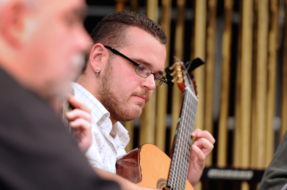 A student playing guitar